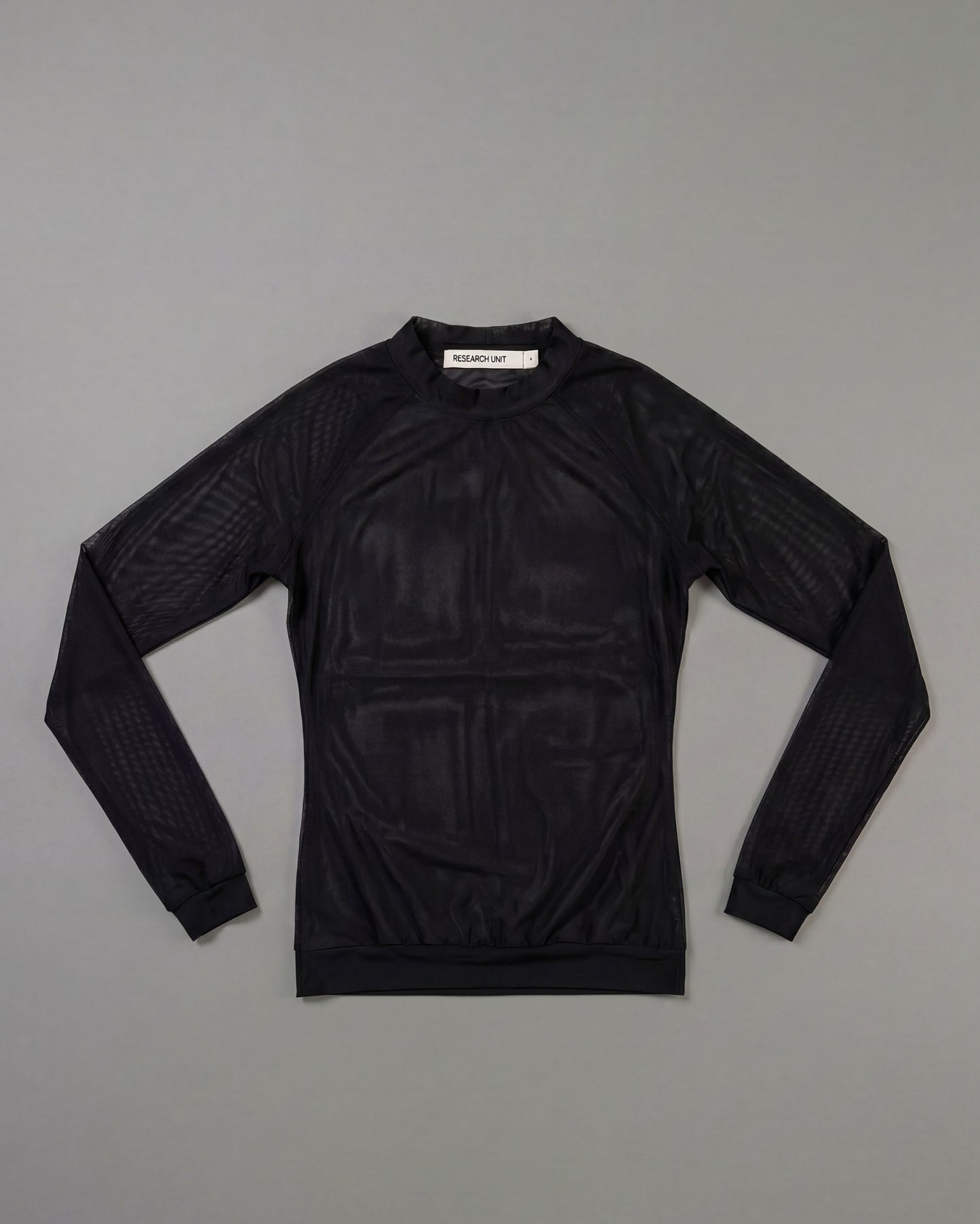 Black long-sleeve shirt on a gray background