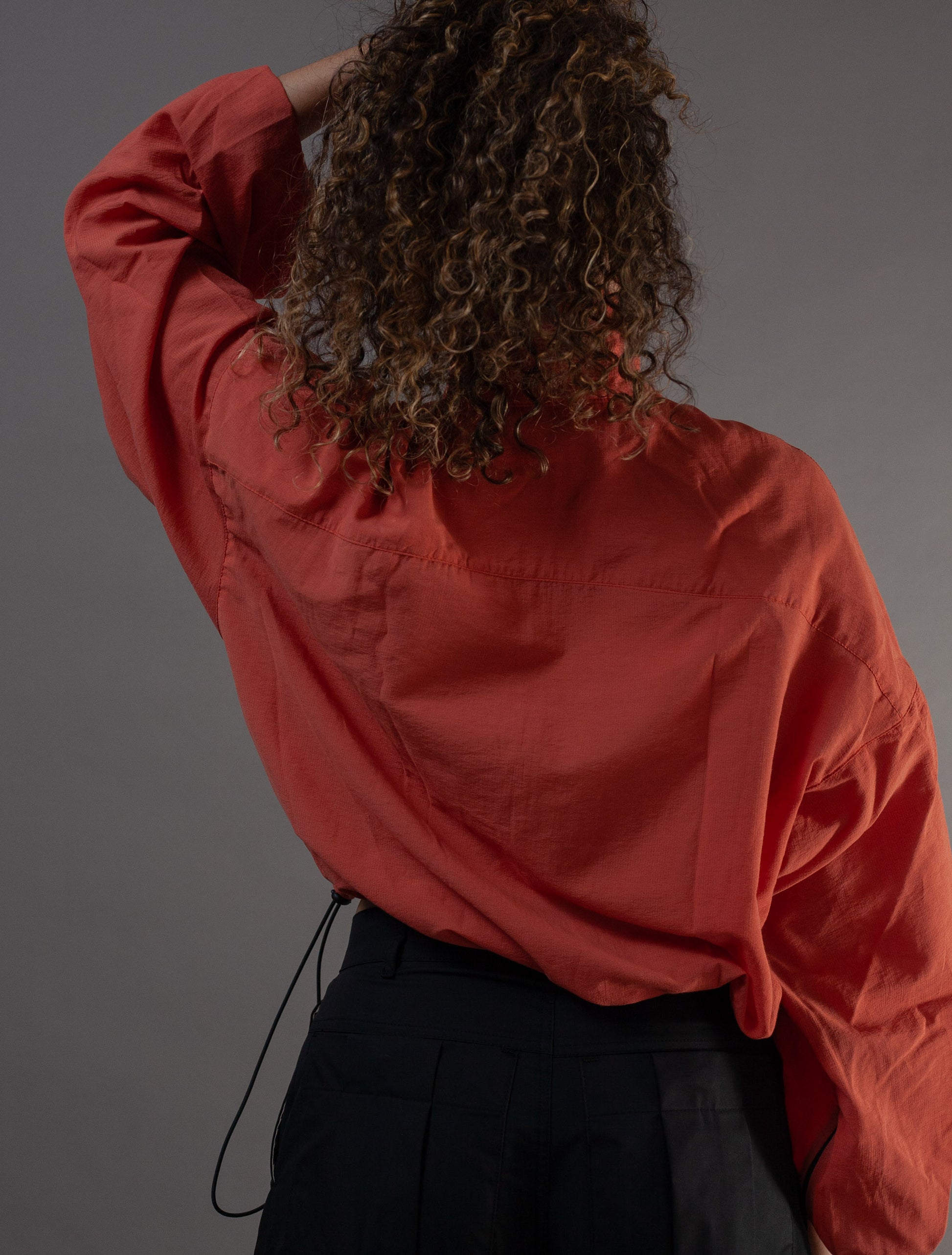 back view of orange Asia top